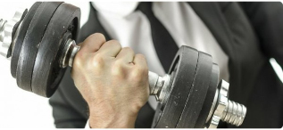 a man holding dumbbells